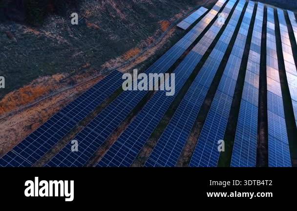 Solar Array Reflections Blue solar panel rows. High angle perspective showing the texture and ...