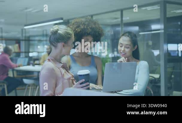 Three women collaborating at laptop in tech hub sparking charts and ...