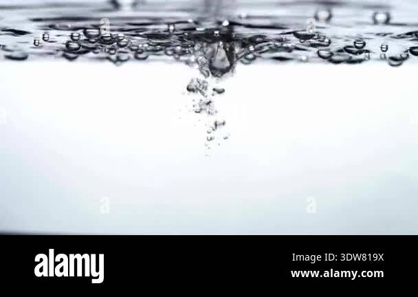 Underwater Object Dropping into Water Creating Splash with Bubbles and ...