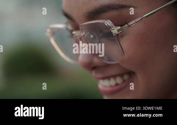 Closeup portrait of young Asian woman wearing square glasses and ...