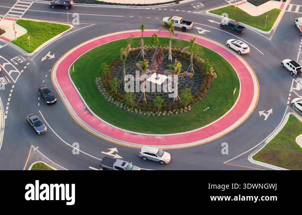Traffic circle on American road with driving cars. Overhead view of US ...