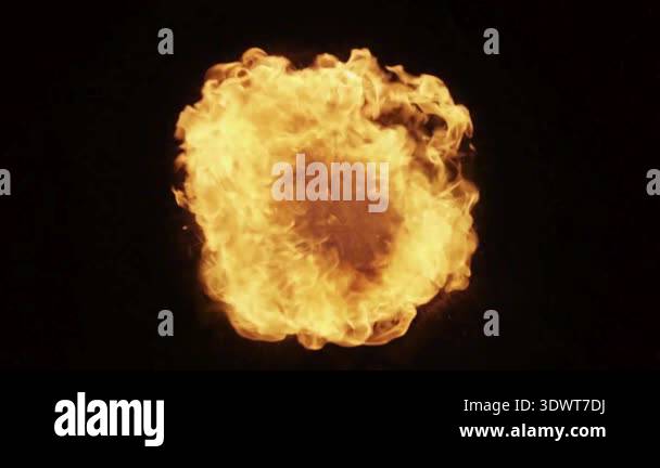 Powerful orange fireball explosion bursting against a black background ...