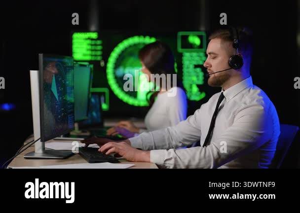 Male and female technical support specialists using headsets and ...