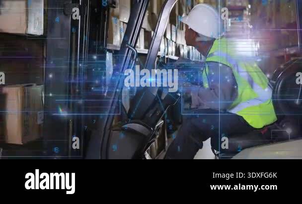 Factory Operator Loading Forklift operator in warehouse checking load and lifting pallet with ...