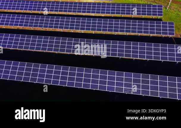 Multiple horizontal lines of photovoltaic modules creating a repetitive ...