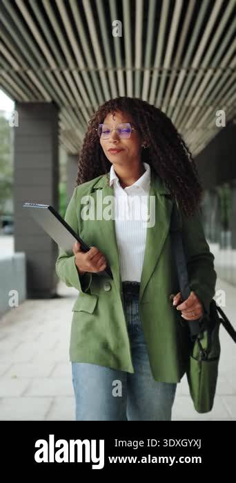 Confident African American business woman walking in office. Portrait ...