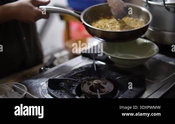 Close up of anonymous woman cooking instant noodles or