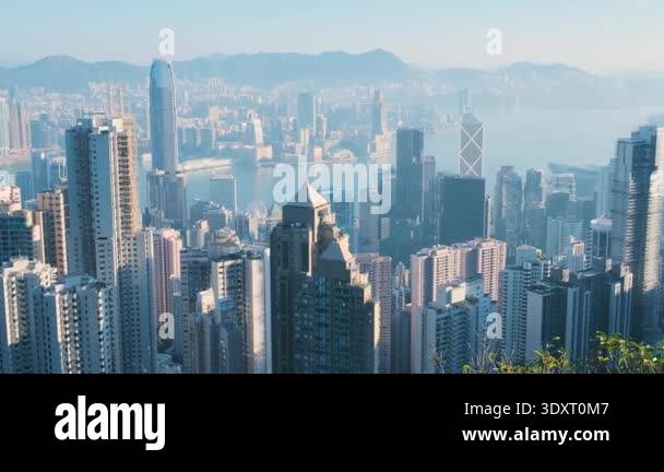 Skyline of Hong Kong city and Victoria Harbour seen from the slopes of ...