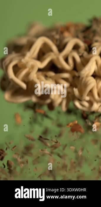 super slow motion instant noodles with herbs and spices suspended in ...