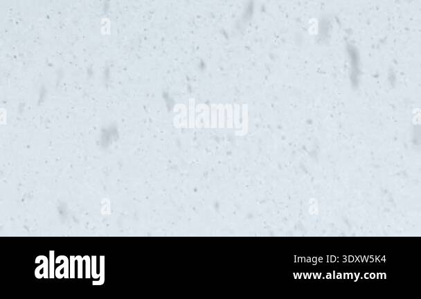 close-up-of-snowflakes-falling-against-a-white-winter-sky-soft