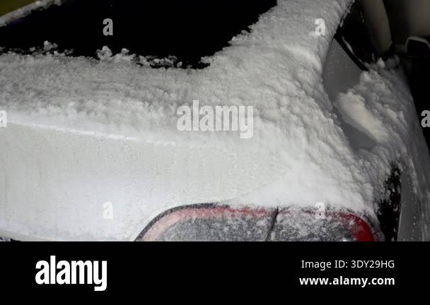 Challenges Car Rear The rear of a white car is covered in a thick layer of fresh snow ...