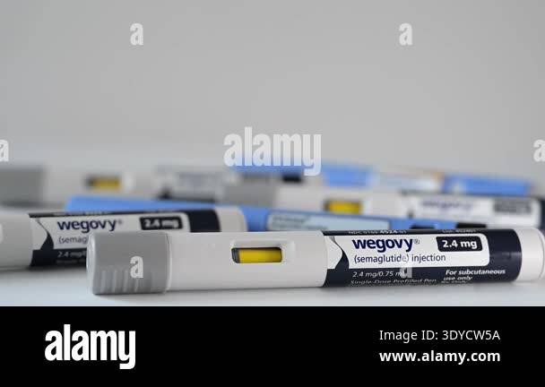 Vadnais Heights, Minnesota. January 30, 2026. Selective focus photo  Illustration of Wegovy semaglutide injection pen with Ozempic, and Victoza.