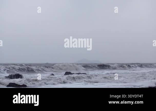Stormy North sea waves hitting rocky coast Stock Video Footage - Alamy
