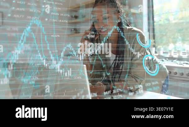 Woman taking finance call at kitchen counter, typing on laptop while ...