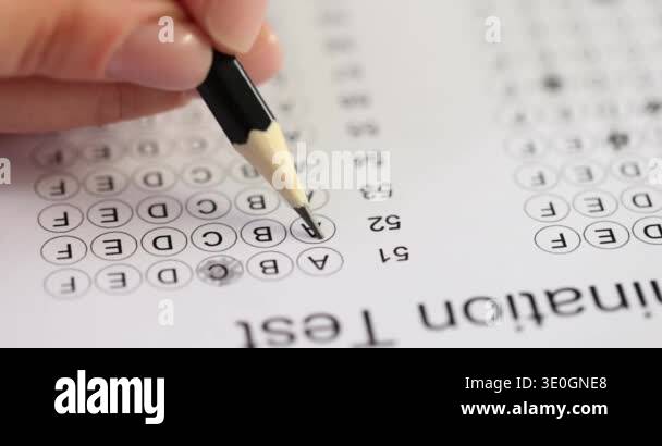 Student takes test highlighting answer with pencil. Woman shades circle ...