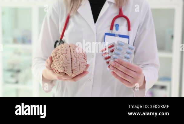 Brain and pills in hands of a doctor. Nootropics use to improve memory ...