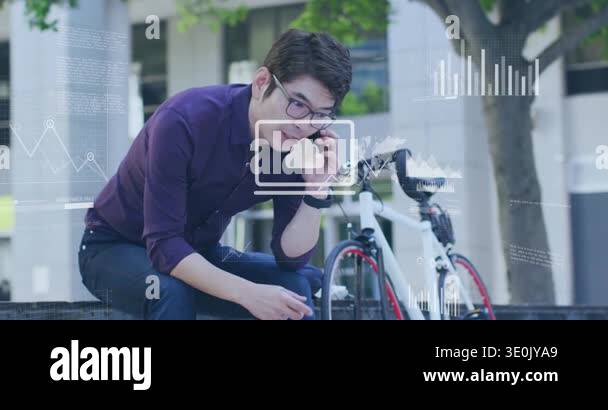 Businessman answering phone on ledge, gesturing while interacting with ...