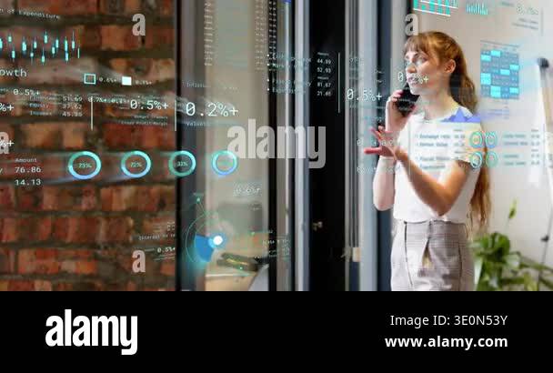 Woman answering phone explaining data on call, gesturing and laughing ...