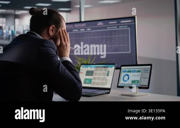 Uncomfortable businessman rubbing temples due to migraine, intense ...
