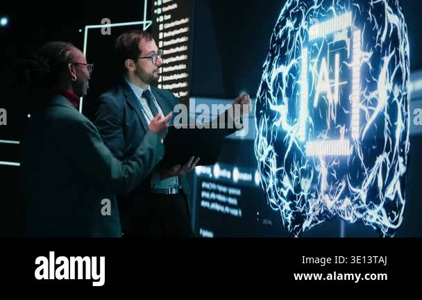 Engineering team looks at AI machine learning self writing code on ...