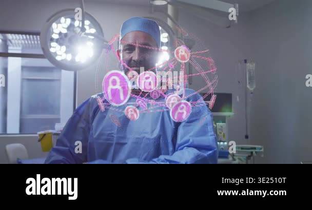 Male surgeon activating AR in operating room, reviewing rotating pink ...