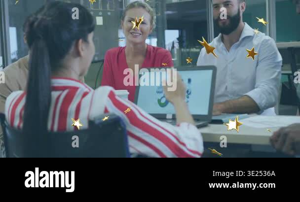 Presenter gesturing to laptop in business meeting showing charts while ...