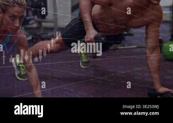 Man Straining As He Rows Man and woman performing plank rows on gym floor, initiating financial ...