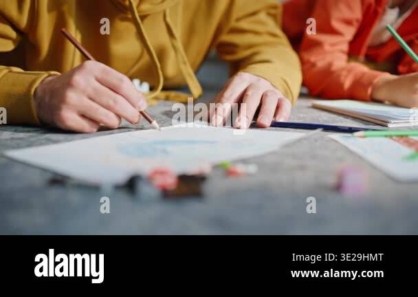Dad son hands drawing colorful pencils lying home carpet closeup. Happy ...