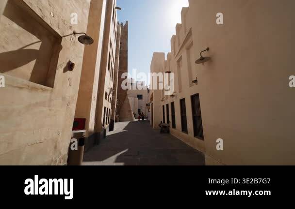 Doha, Qatar - January 20 2026: Traditional narrow street with historic ...