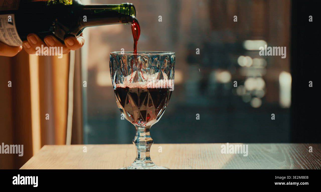 Pouring red wine into glass Stock Video Footage - Alamy