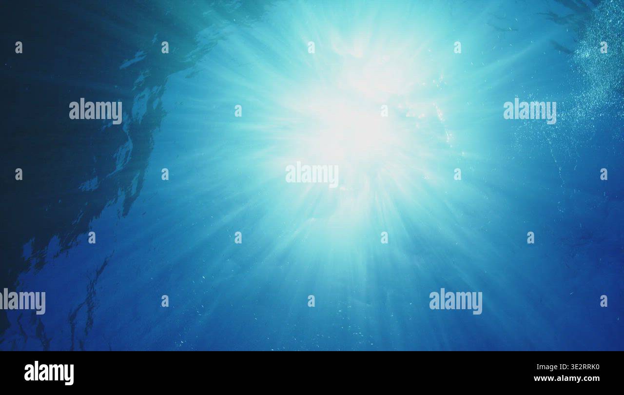 Sun rays through ocean water from underwater Stock Video Footage - Alamy