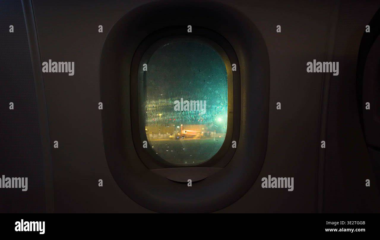 Night flight window view before take off Stock Video Footage - Alamy