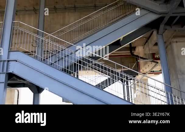 Industrial steel staircase structure inside modern building with ...