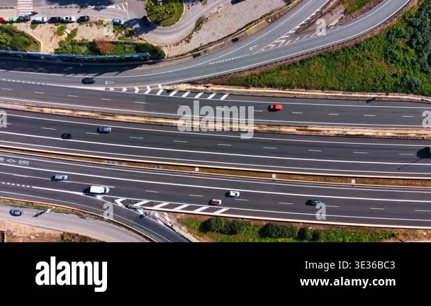 Exit Ramp Driving Highway exit ramp and traffic. Vertical aerial shot of motorway lanes ...
