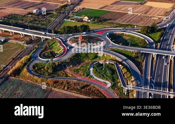 Complex road roundabout and highway interchange. Wide drone shot of a ...