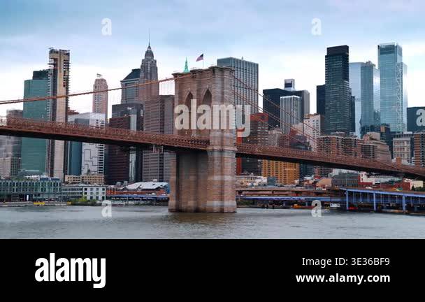 The Brooklyn Bridge from the riverscape at daytime. Modern skyline of ...