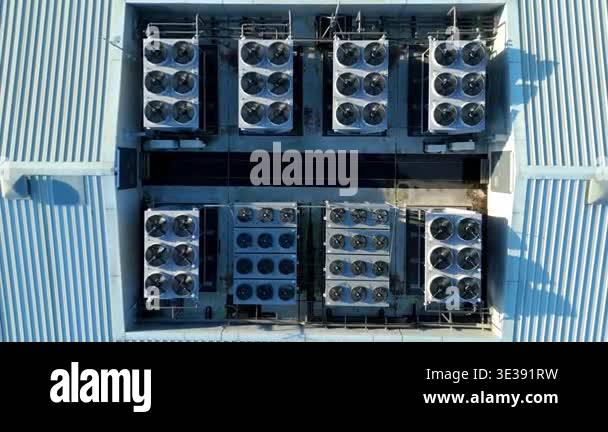 High angle aerial drone view of a large scale futuristic data center in ...