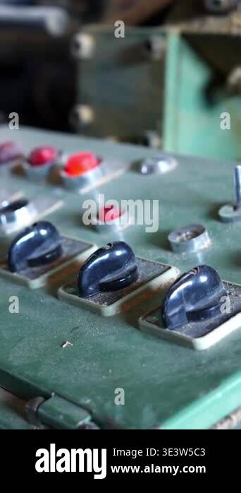 Close up view of a dusty and old industrial machine control panel with ...