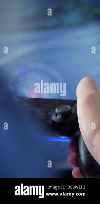 Video games. Close up of young man hands playing video games on gaming ...