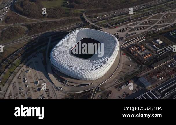 High altitude flight over futuristic Allianz Arena stadium, iconic ...