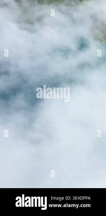 Fresh Look at Thick Clouds Or Mist Partially Obscure A Landscape Below Creating