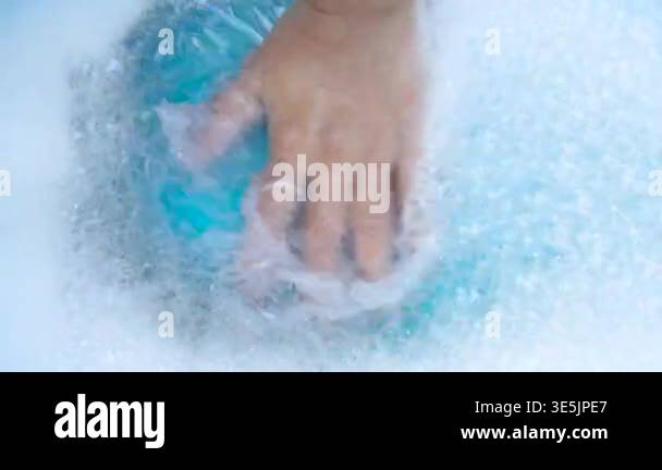 Hands Mixing Detergent Foam powder in Water, Close-up, Laundry Concept ...