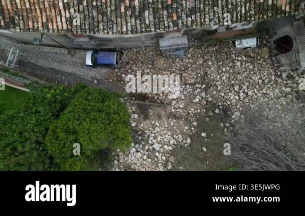 A landslide and collapse, an environmental disaster and destruction ...