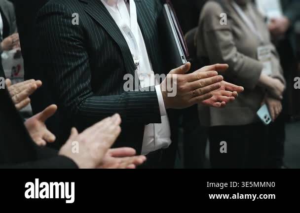 Close up of business audience clapping hands during conference seminar ...
