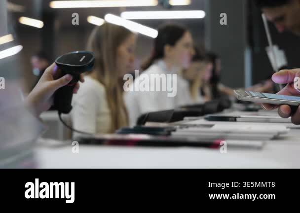 Close up of attendee scanning QR code on smartphone during conference ...