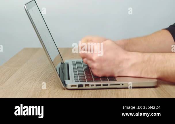White Male Hands Punching Laptop Screen, Closeup On Wood Desk With ...