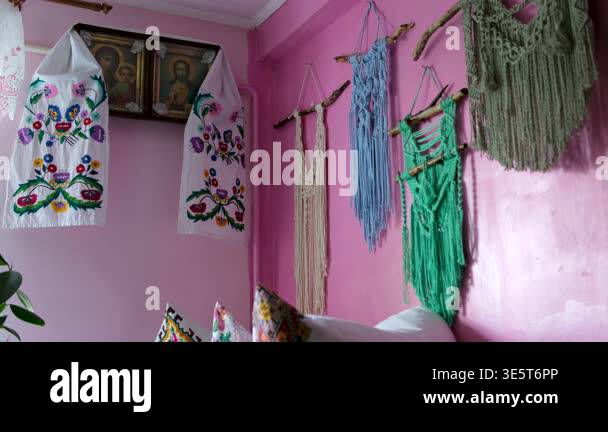 icons with Ukrainian embroidered towel on the wall in a village hut ...