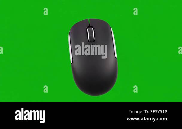 A black wireless computer mouse is shown isolated on a vibrant green ...