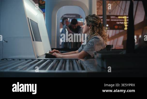 Focused Female Security Officer in Professional Uniform Operates ...
