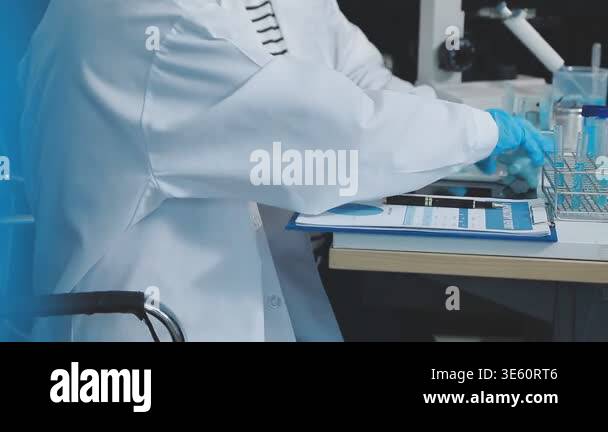 scientist in a laboratory with a microscope Stock Video Footage - Alamy